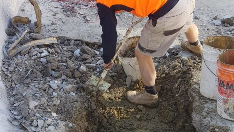 Mt Eliza pool digging out the road base underneath the false floor