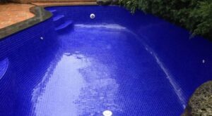 fully tiled dark blue pool interior